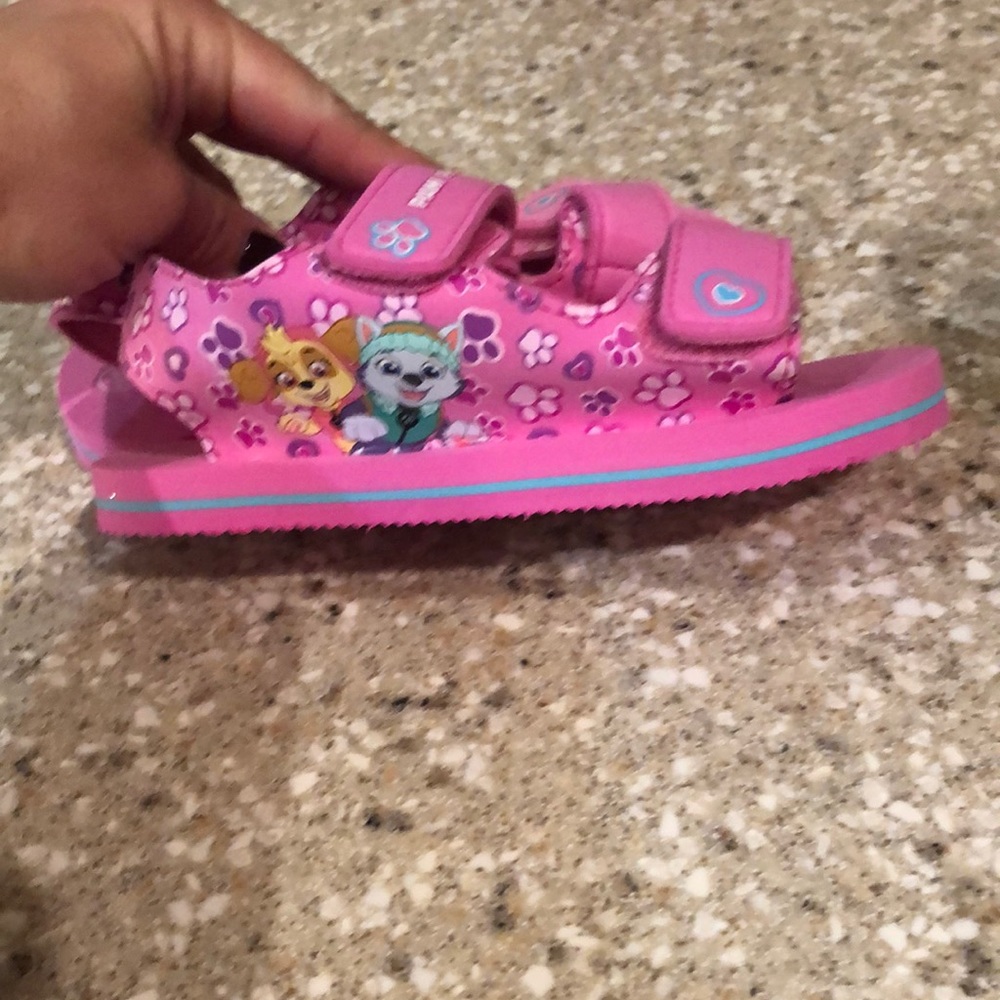 Never been worn Paw Patrol flip flops